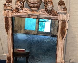 Vintage wooden wall mirror with beautiful floral urn crest at the top