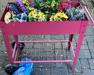 Hot pink mobile raised garden bed cart