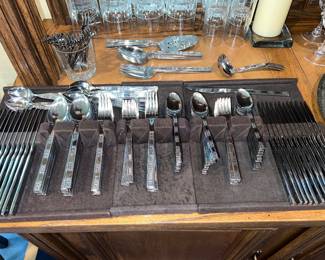 Vintage silver-plated flatware set with serving pieces