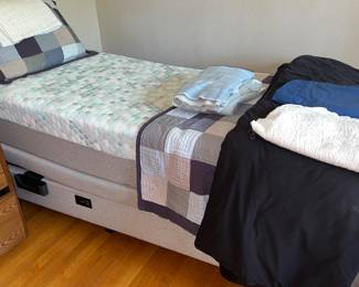 Adjustable single bed with built-in power outlets
