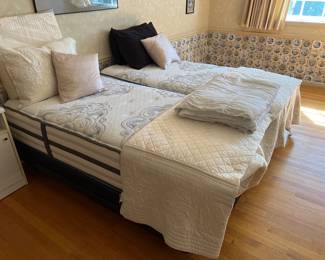 Two side by side twin beds