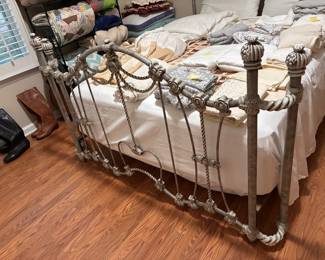 footboard detail of wrought iron bed