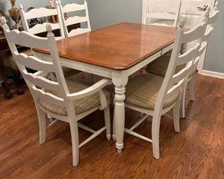 white table w 6 chairs and a leaf length w/o leaf 60" with leaf 78" 38" w $534.00