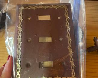 Several metal switch plate and outlet covers