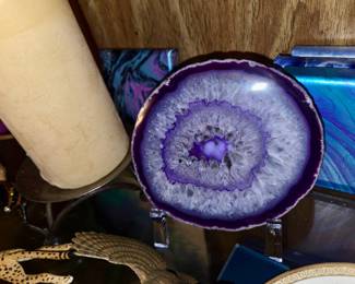 polished purple-dyed agate slice featuring a sparkling quartz crystal center