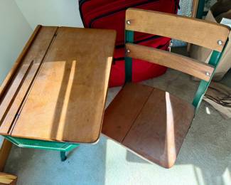 vintage children's wooden school desk with an attached green metal-framed swivel chair, likely from the mid-20th century