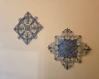 Pair of scrolled metal wall medallions, decorative