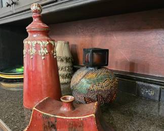 Red glazed ceramic vases and a beaded vase