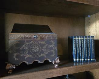 Ornate wooden decorative box with brass feet