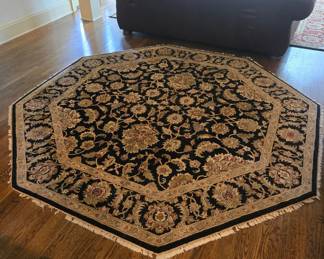Octagonal wool area rug, black floral Persian design