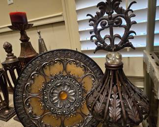 Ornate decorative pieces: candle stand, medallion plaque, finial set