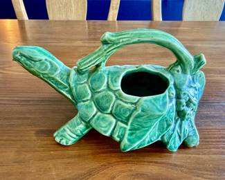 vintage 1940s Nelson McCoy USA Pottery Green Turtle Watering Can or Planter, featuring a glossy jade green glaze, an arched twig-like handle, and leaf-and-berry detailing