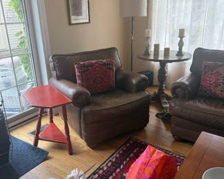 Leather chairs, small tables