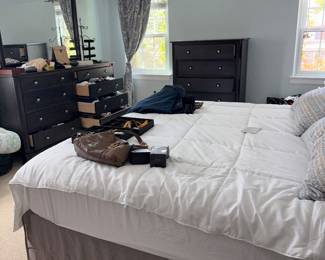 King size bed, dresser, and tables and high boy