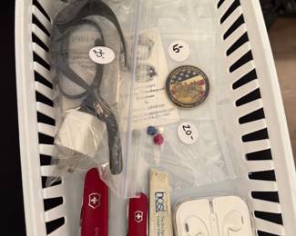 Pocket knives, Ear buds, Fitbit