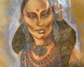 Color fantasy costume portrait with an ornate jeweled headdress and layered necklaces