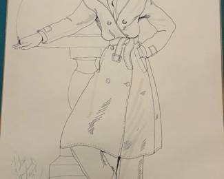 Costume drawing labeled “Burt Reynolds” and “Back Street,” depicting a belted double-breasted trench coat. The sheet bears “Bobbie Mannix 74” lettering and a green personal inscription to Tom. Presented with a teal mat; a distinctive menswear study from his Hollywood costume collection.