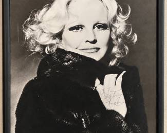 Framed black-and-white portrait photograph with a handwritten dedication to Tom. The close-up composition, dark wrap and simple black frame make it a striking addition to the estate’s entertainment memorabilia. See the inscription and photograph in person for details.