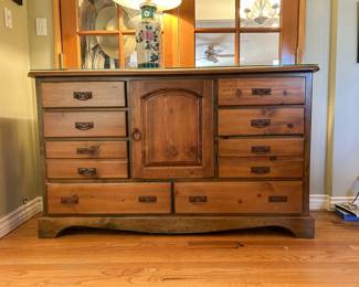 Wooden dresser with multiple drawers central cupboard and attached mirror from the Tom Culver estate