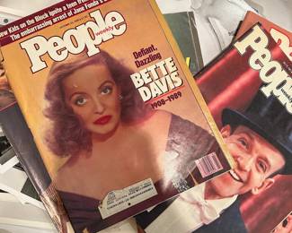 Vintage People magazines featuring Bette Davis and Fred Astaire displayed with Hollywood photographs