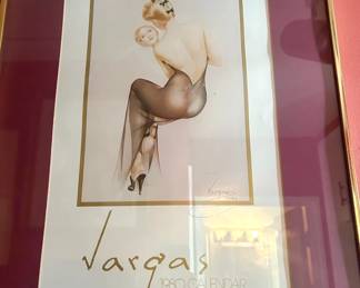 Framed Vargas 1980 Calendar artwork featuring a seated glamour figure with a hand mirror. “Vargas” and “1980 Calendar” are printed prominently below the image. Presented with a burgundy mat and gold-tone frame; a collectible calendar piece from Tom Culver’s collection.