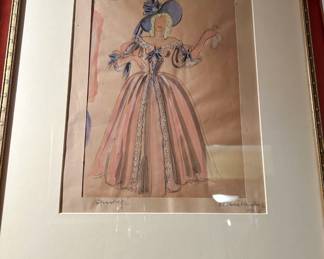 Framed costume illustration of a pink full skirted period gown with a blue waist sash
