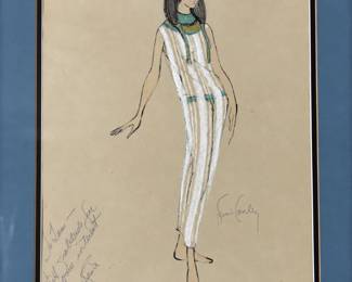Egyptian inspired costume drawing of a white gown with a jeweled collar and handwritten dedication in a blue mat