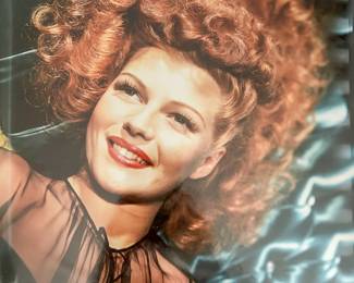 Color Hollywood glamour portrait of a red haired performer in a dramatic updo from the Tom Culver photograph collection