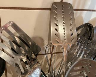 Metal serving utensils and kitchen tools from the Tom Culver estate household collection