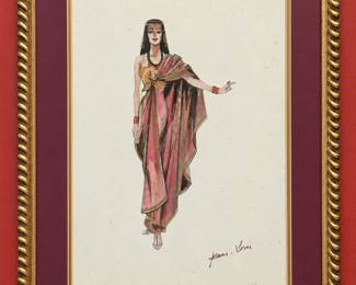 Framed costume illustration of an Egyptian-inspired draped gown in rose and gold tones, with colorful jewelry and a headdress. A signature appears at lower right. Displayed with a burgundy mat and gold-tone frame, from Tom Culver’s Hollywood collection.