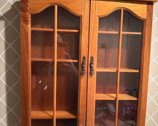This curio is in the hallway bath