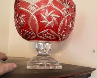 Beautiful cut glass center bowl on clear stand with round top in red