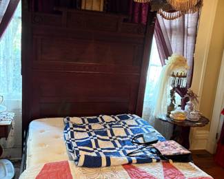 Hand made quilts laying on a great 3/4 size half tester bed with new custom made mattress, custom made drapes made by the late Jerry Stacy from Aberdeen and new tuffed insert inside tester, exceptional bed for someone wanting to start a great antique collection 