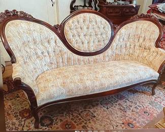 Walnut Victorian parlor sofa with good upholstery 