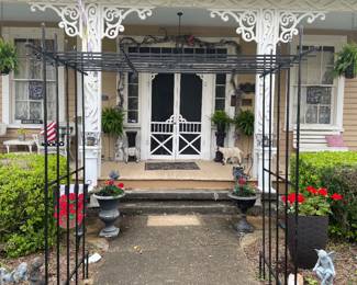 Photo from street view of Mon Chalet going through original antique Antebellum split wood doors 