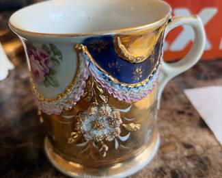 Beautiful hand painted coffee cups with applied flowers and decorations and gold Leaf paint 