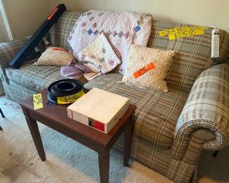 Sleeper Sofa, Pillows, Sound Bar on the far left
