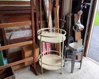 On left is original herb rack.center is a round, two tiered wrought iron server or side patio table; right is a plant stand. 