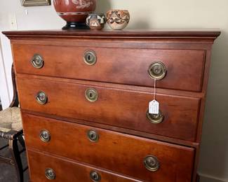 Cherry Chippendale chest in excellent condition. Two pieces of Native American pottery.