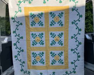 Yellow and green design on white background. Vine border is a lovely design to this excellent quilt.