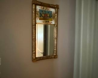 Early Gilded mirror with original reverse painting. Mirror has been replaced.