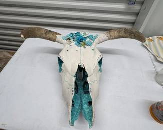 Decorated skull with turquoise painted accents