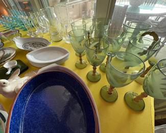 My favorite things on this table -- the very fine (thin) MCM blue glassware set on the left, and the vintage plastic glass set on the far right.