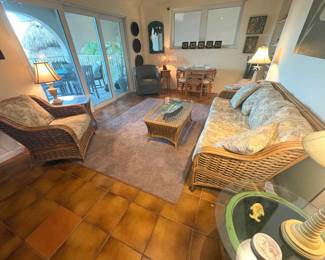 The mirror in the back corner made of copper features some friendly little manatees. Also love the metal leaf shaped tray pictured on the coffee table.