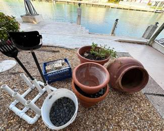more pots and garden accoutrements (polished black river rock and coral bricks)
