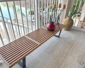 Love the lines of this solid wood patio bench. (Not pictured, glass top that could turn it into a low coffee table.)