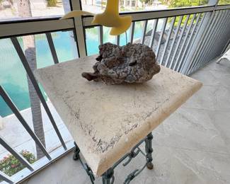 Metal base, stone top = can withstand florida climate!