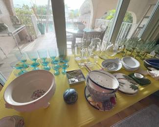 My favorite things on this table -- the very fine (thin) MCM blue glassware set on the left, and the vintage plastic glass set on the far right.