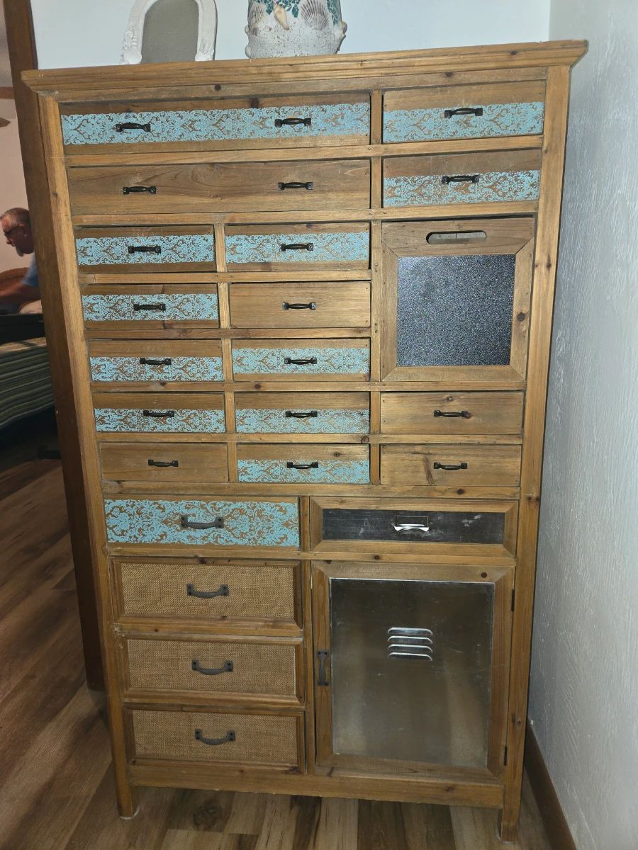 Apothecary Cabinet with Nautical Flair. Metal Accent on Bottom Right