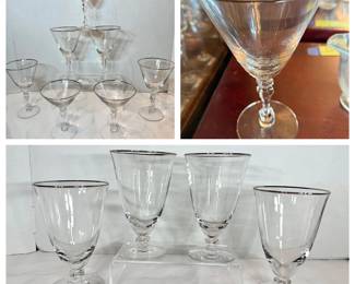 Silver Rim Stemware and Tumbler Lot A glassware lot including six cocktail or wine glasses with twisted stems and slender bowls, alongside a set of footed tumblers with silver rim banding in graduated sizes. The silver banding is intact and bright at the rims and the glass is clear throughout. A coordinated grouping for entertaining.